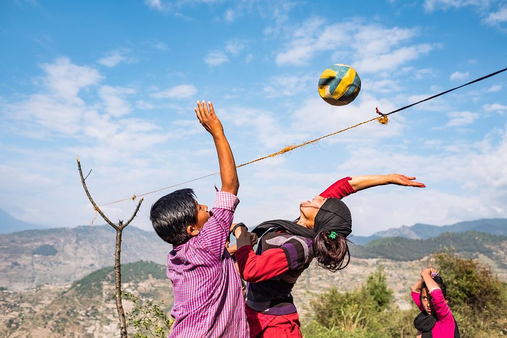 People playing volleyball on mountain, Kailash, Bajhang District, Nepal, October 2017.