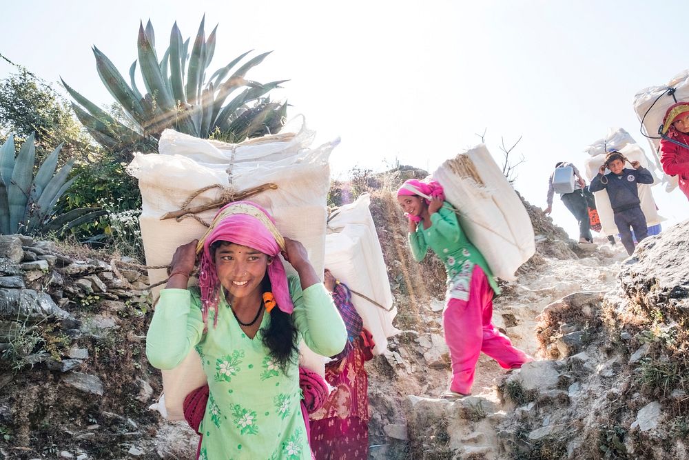 people carrying Lokta bark paper bundles, Kailash, Bajhang District, Nepal, October 2017.