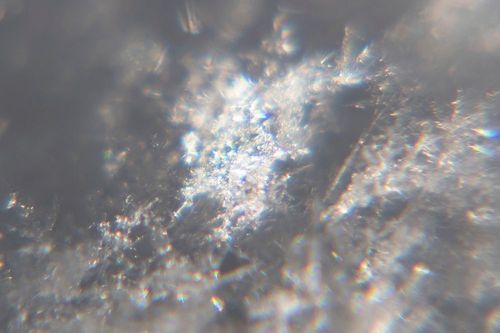 Snow crystals glittering in strong direct sunlight 33 - cropped