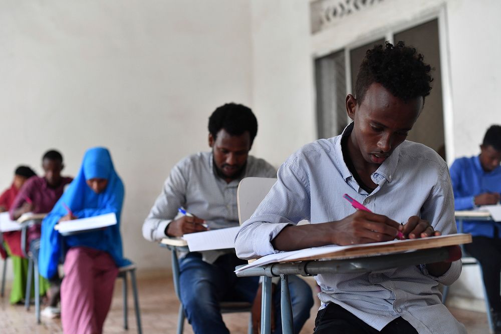 Secondary students take their national examinations in Mogadishu, Somalia, on 22 May 2018. Original public domain image from…