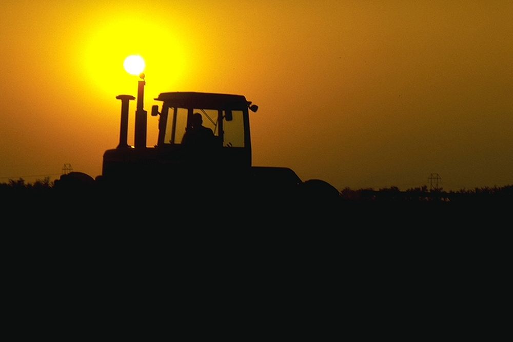 tractor at sunset. Original public domain image from Flickr