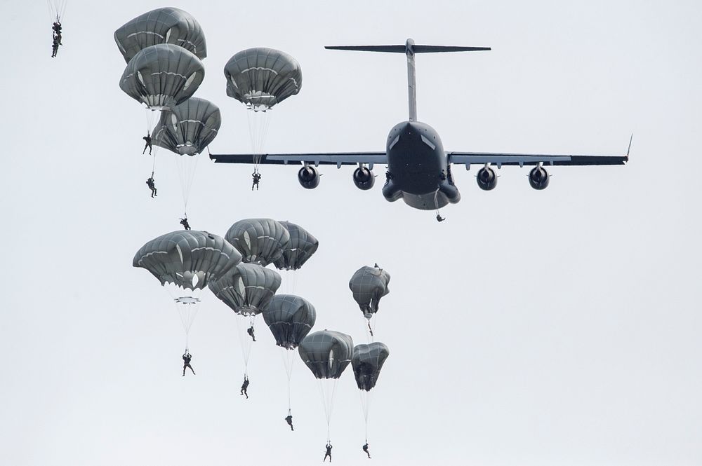 U.S. Army paratroopers, military jet. Original public domain image from Flickr