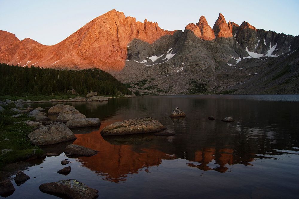 Sunset and shadows of Cirque of the Towers (west side) looking across Shadow Lake in Bridger Wilderness, Bridger-Teton…