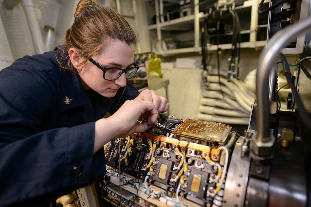 MEDITERRANEAN SEA (May 20, 2018) Aviation Electrician's Mate 3rd Class Amelia Shaw tests a generator converter unit in an…