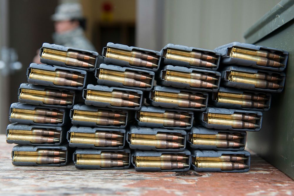 Loaded M4 carbine magazines are staged at an ammunition distribution point for Army National Guardsmen competing in the…