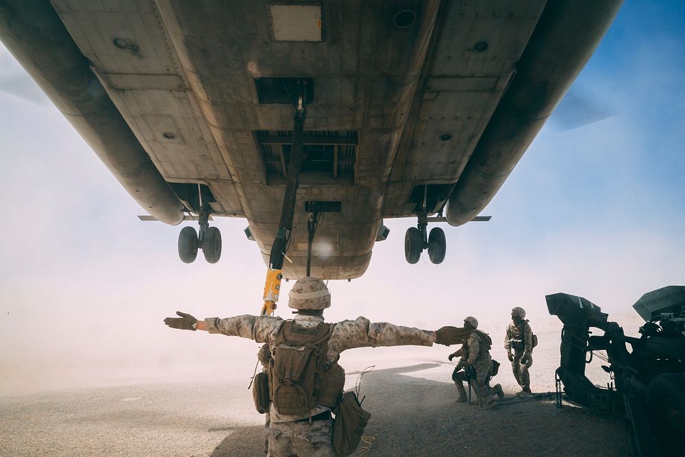 U.S. Marines with Combat Logistics Battalion 8, 2nd Marine Logistics Group preform an external lift with a CH-53E Super…