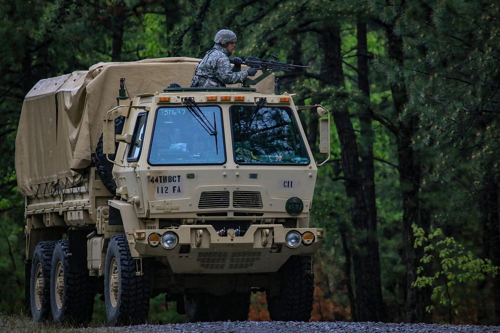 U.S. Soldiers assigned to the New Jersey Army National Guard's 253rd Transportation Company look for simulated enemy forces…