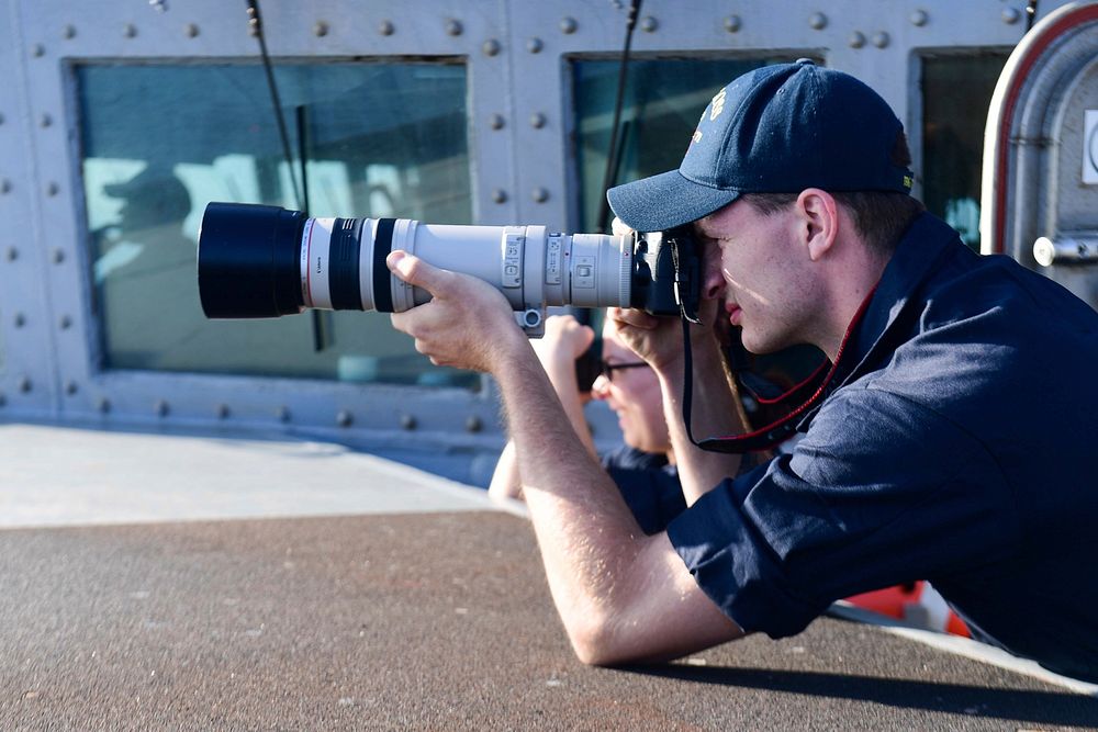 STRAIT OF GIBRALTAR (Aug. 17, 2018) - Interior Communications Electrician 3rd Class John Stark takes a photo for ship's…