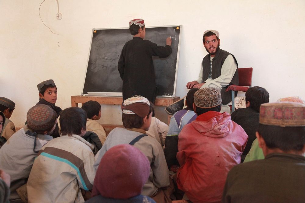 An Afghan teacher leads class in Now Zad, Afghanistan, Dec. 17, 2009.