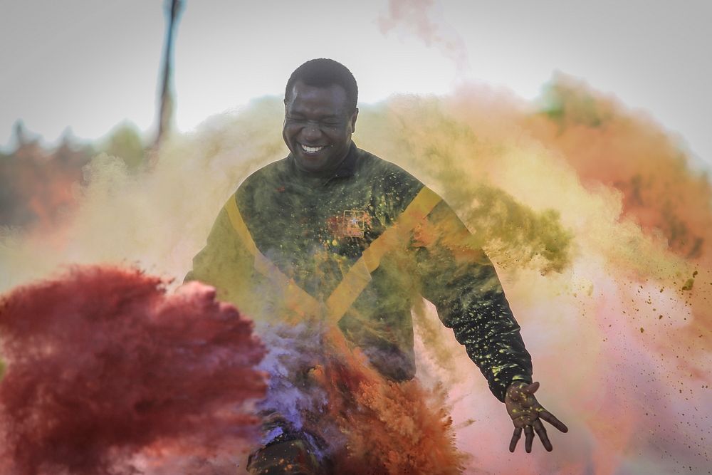 A U.S. Army National Guard Soldier crosses the finish line at the 2018 New Jersey National Guard LGBT 5K Color Run on Joint…