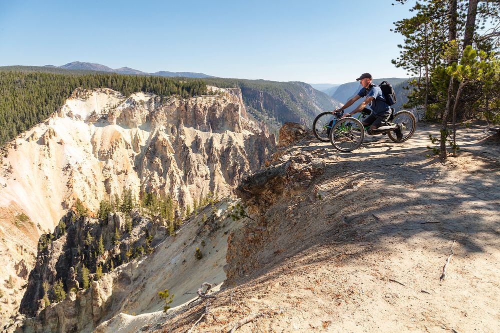Overlooking the Grand Canyon of the Yellowstone from an off-road wheelchair by Jacob W. Frank. Original public domain image…