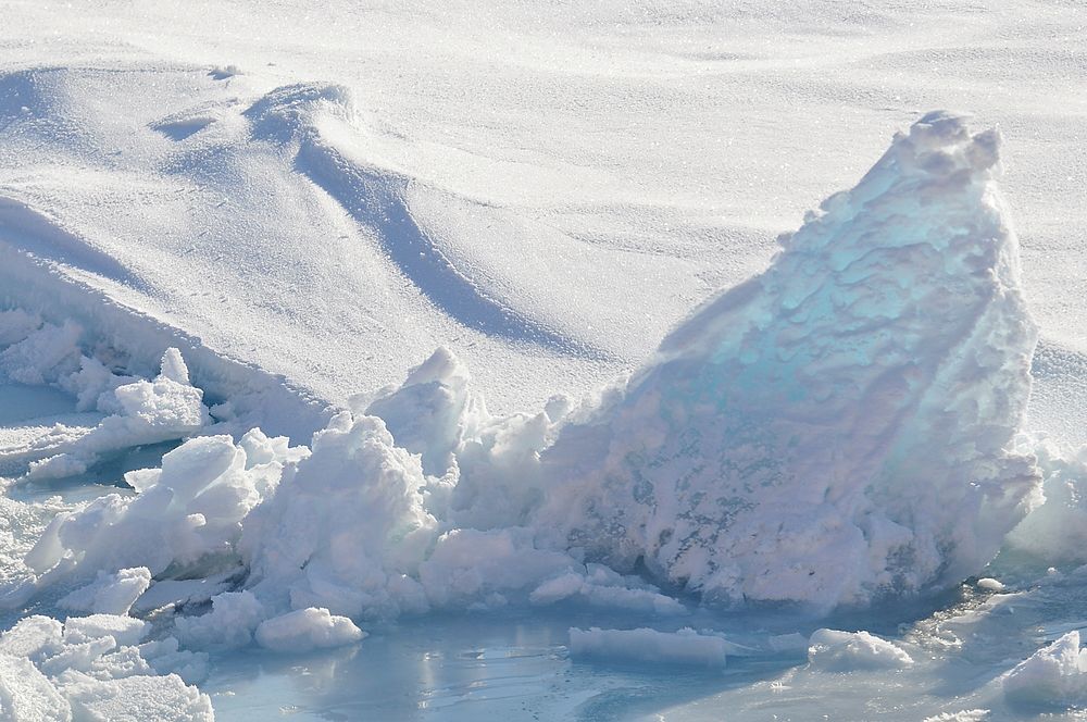 The sun shines through a piece of ice on the Arctic Ocean Sept. 1, 2009.Photo Credit: Patrick Kelley, U.S. Coast Guard.…