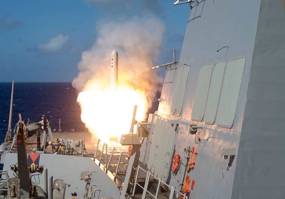 A Tomahawk cruise missile launches from the Arleigh Burke-class guided-missile destroyer USS Shoup (DDG 86) during a live…