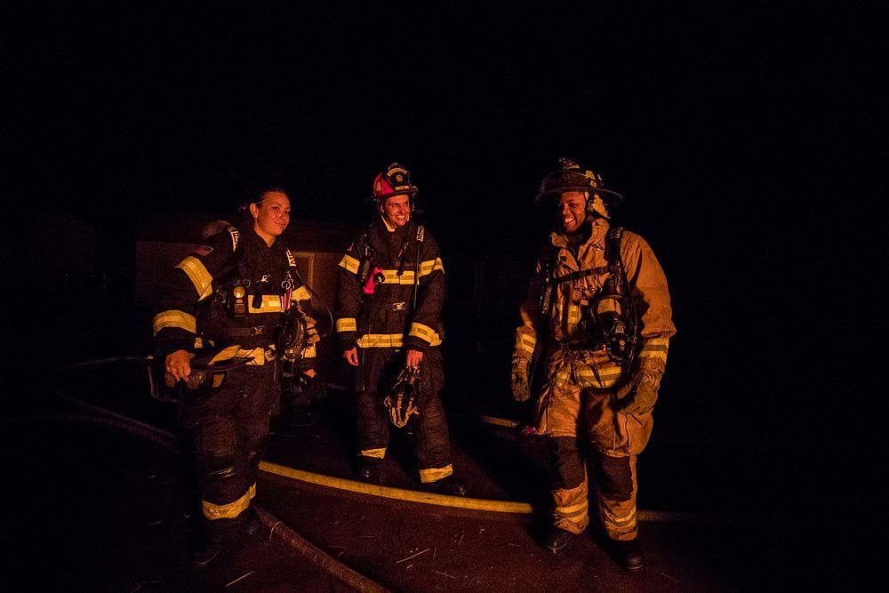 Fighterfighters wait for their turn to enter a building during live burn training at the Anthony "Tony" Canale Training…