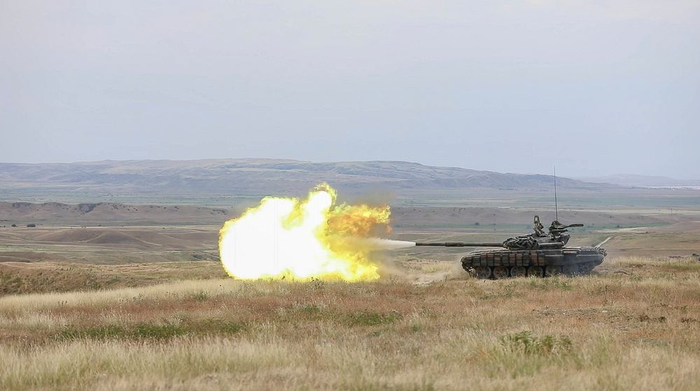 A Georgian Armed Forces T-72 tank engages targets down range as part of a live fire training during Noble Partner 18 at the…