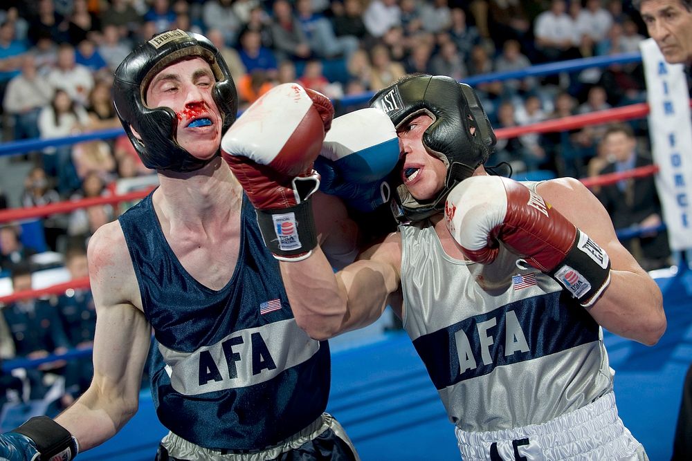 USAF Academy CO. -- Junior Mike Mizes throws an uppercut to the jaw of freshman William Petersen during the Air Force…