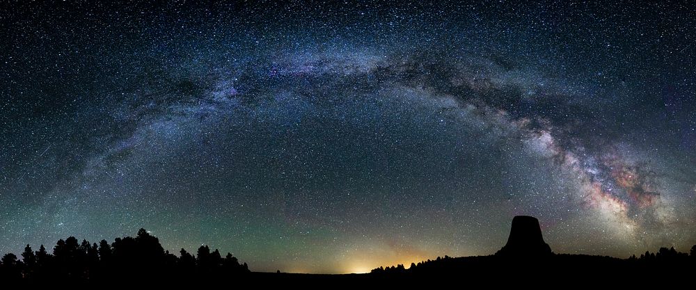Devils Tower National Monument, Milky Way arching over Devils Tower. Photo by Damon Joyce. Original public domain image from…