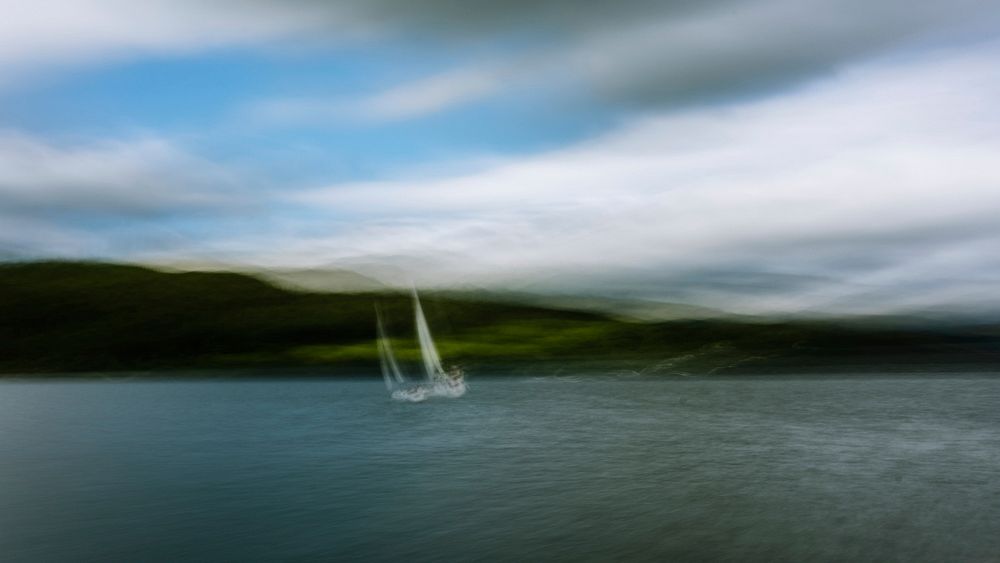 Blurry sailboat in ocean. Original public domain image from Flickr