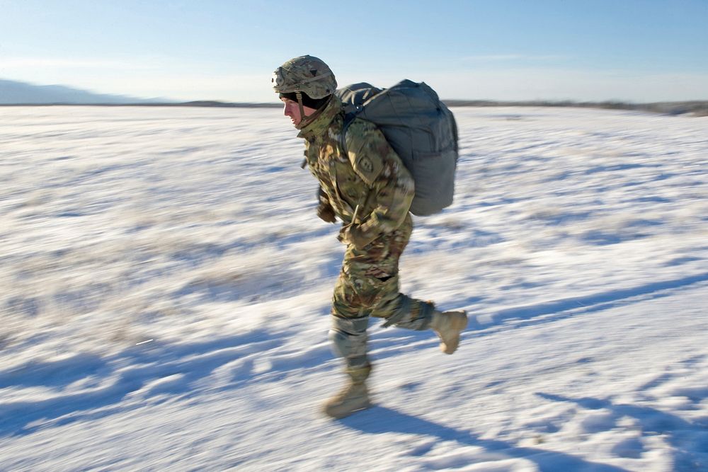 A paratrooper assigned to the 4th Infantry Brigade Combat Team (Airborne), 25th Infantry Division, U.S. Army Alaska, runs to…