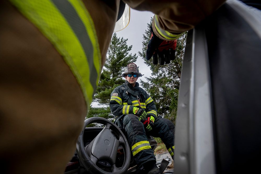 A New Jersey Department of Military and Veterans Affairs Fire Captain Brian Bramhall listens to a briefing about extraction…