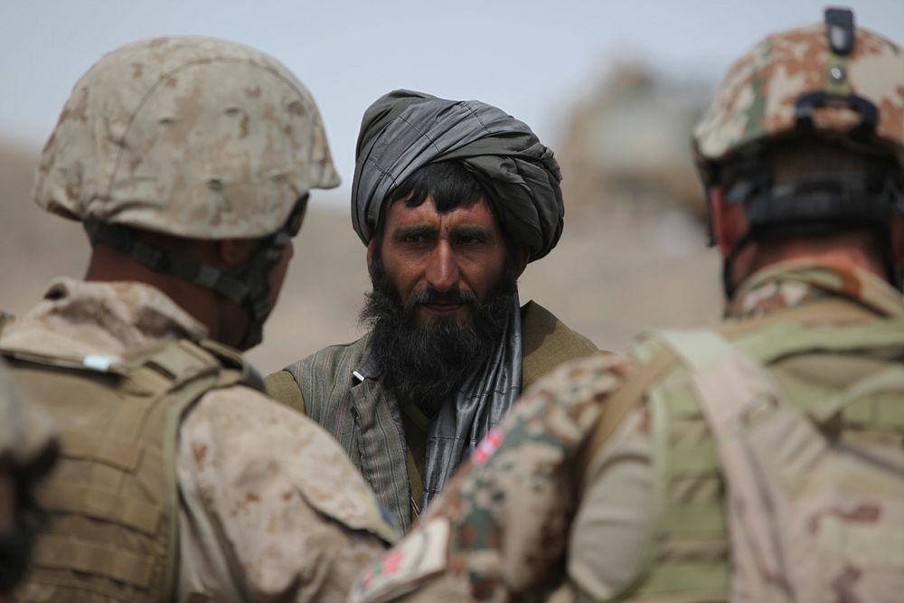 Marines speak to Afghan man