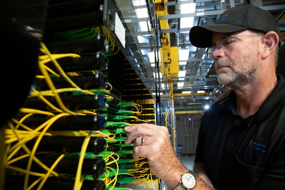 North Central Telephone Cooperative Corporation (NCTC) Central Office Technician Eddie Blankenship installs a fiber optic…