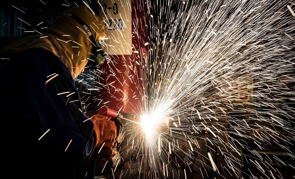 MEDITERRANEAN SEA. Damage Controlman Fireman Mateo Lopez practices using a portable exothermic cutting unit aboard the…