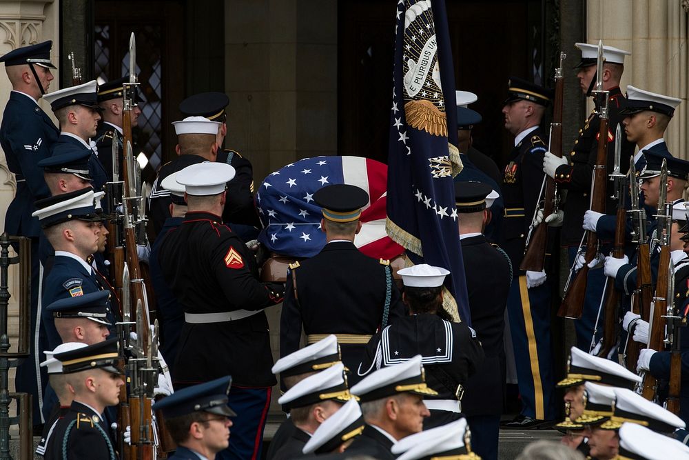U.S. service members with the Ceremonial Honor Guard carry the casket of George H.W. Bush, the 41st President of the United…