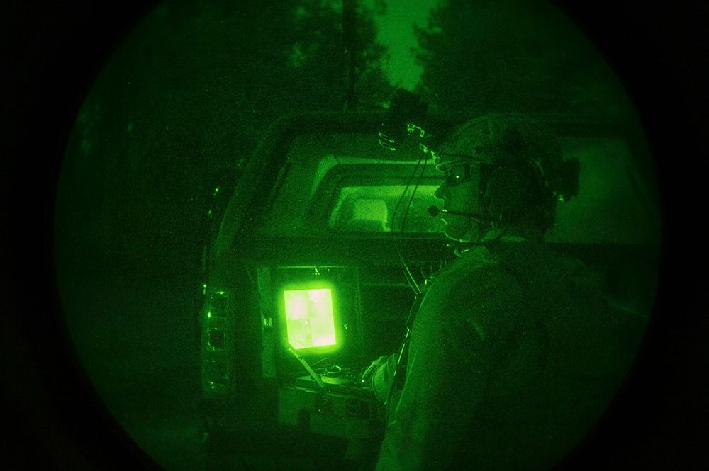 An explosive ordnance disposal (EOD) technician assigned to EOD Mobile Unit 2 drives a TALON EOD robot during night time IED…