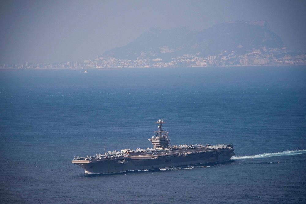 The aircraft carrier USS John C. Stennis (CVN 74) passes the Rock of Gibraltar while transiting the Strait of Gibraltar, May…