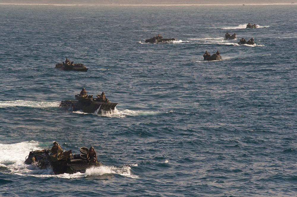 U.S. Marines from Special Purpose Marine Air Ground Task Force 24 transit to the USS New Orleans (LPD 18) in amphibious…