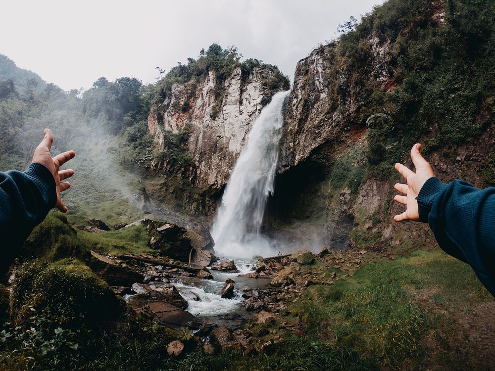 Traveler at waterfall. Free public domain CC0 photo.