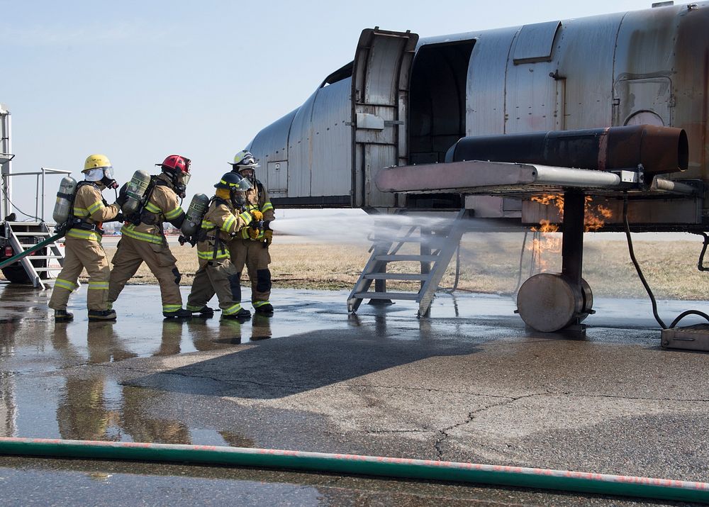 U.S. Air Force and Republic of Korea Air Force members work to extinguish a fire during live fire training at Osan Air Base…