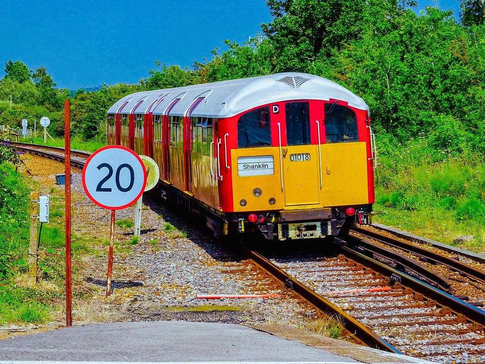 Moving train on a track. Free public domain CC0 photo.