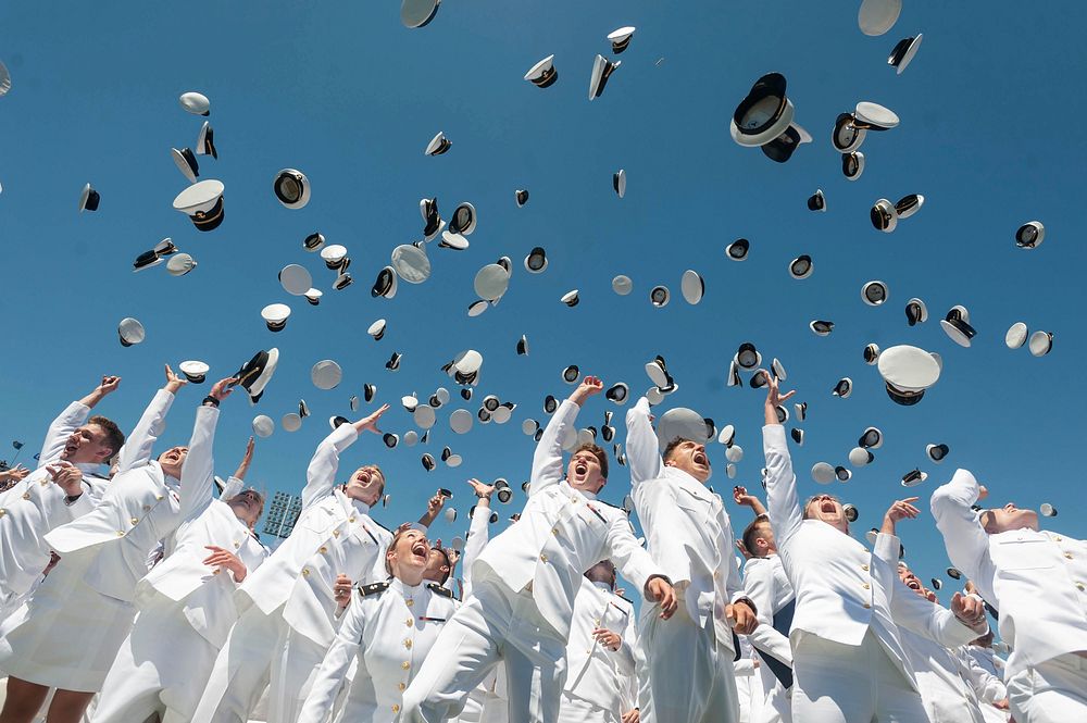 Midshipmen toss their covers in the air during the United States Naval Academy's Class of 2019 Graduation Day and…