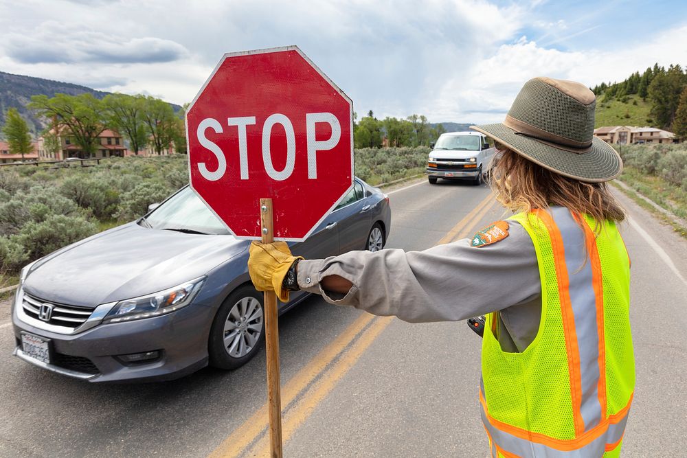 Special projects crew repair the road surface at the Mammoth three-way intersection by Jacob W. Frank. Original public…