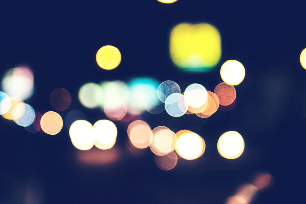 Bokeh from street lights, cars and motorbikes at night.