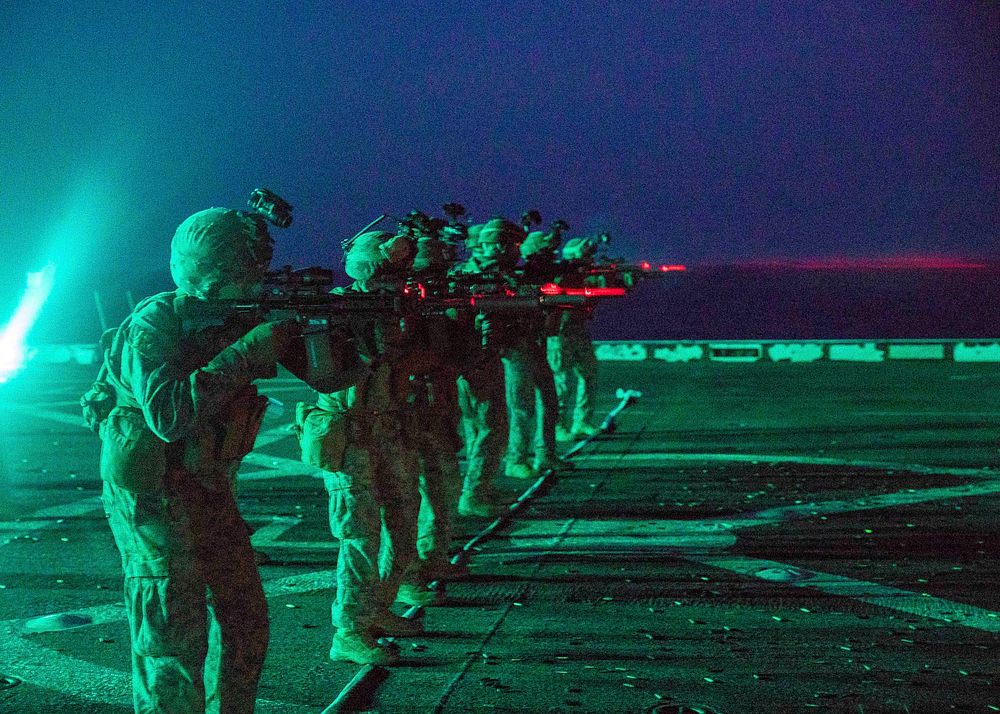 MEDITERRANEAN SEA - U.S. Marines with the 22nd Marine Expeditionary Unit fire service rifles from the flight deck of the San…