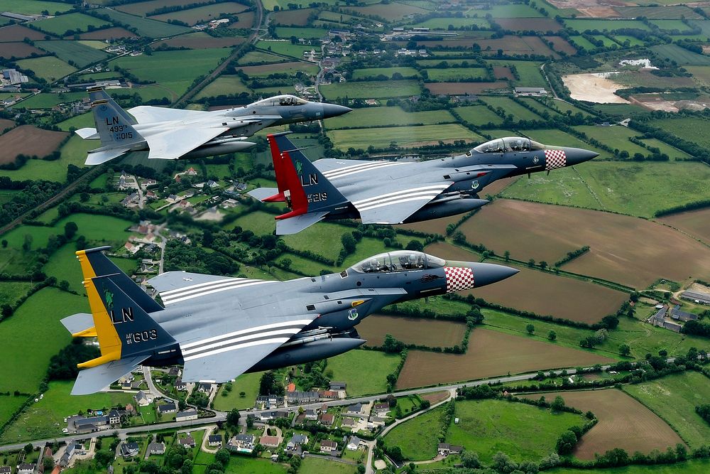 A U.S. Air Force F-15C Eagle and a pair of heritage painted F-15E Strike Eagles assigned to the 48th Fighter Wing conduct a…