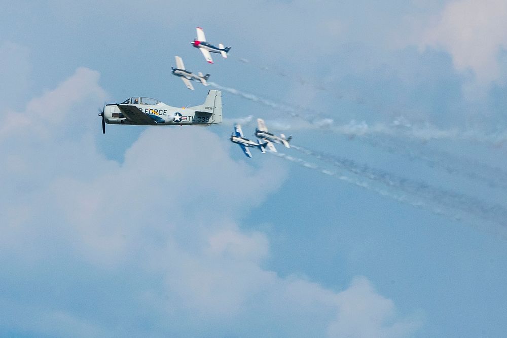 Aircraft fly overhead during the 2019 EAA AirVenture Oshkosh July 23, 2019, in Oshkosh, Wisconsin.