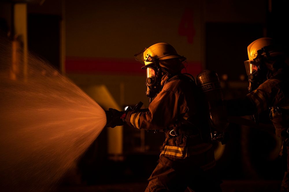 Estonian Air Force firefighters combat a simulated aircraft blaze during Northern Strike 19 at the Alpena Combat Readiness…