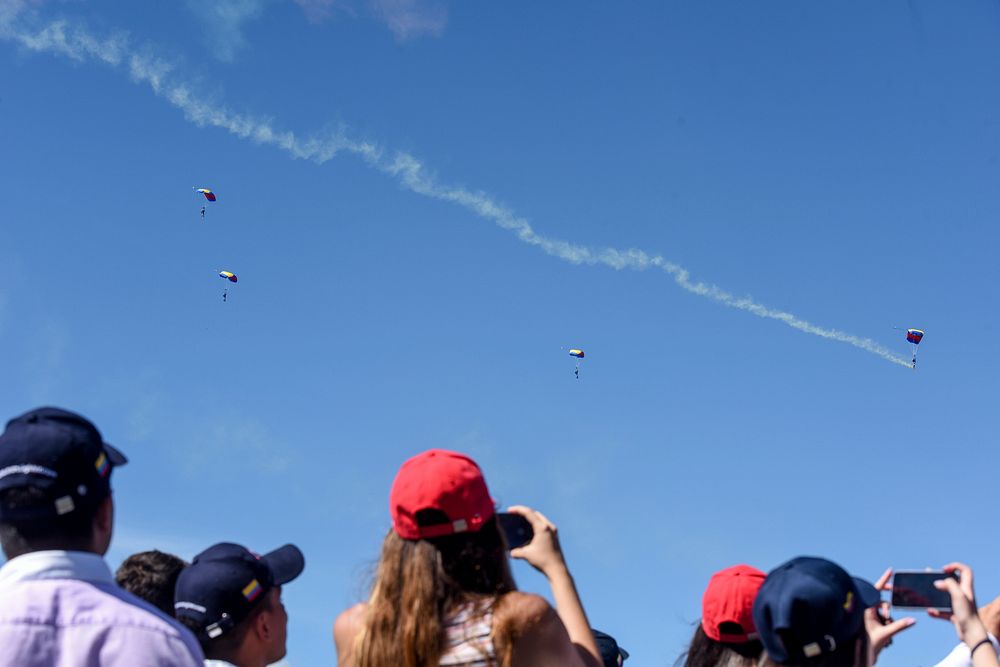 The Colombian Air Force Parachute Team, Gules Eagle, jump during Feria Aeronautical International—Colombia. Original public…