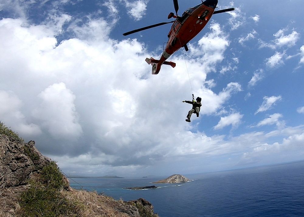 An Air Station Barbers Point MH-65 Dolphin Helicopter crew conducts training off the cliffs near Makapu'u Lighthouse…