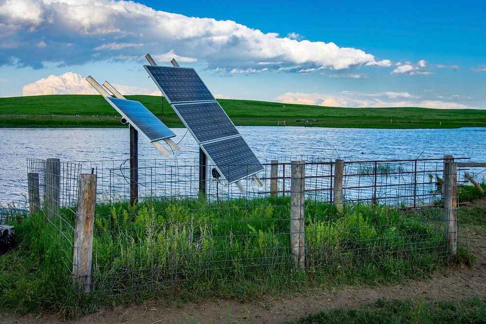 These solar panels generate electricity to pump water from the pit to a stockwater tank in this area of the rangeland. Photo…