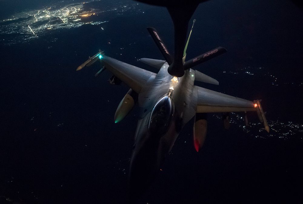 A U.S. Air Force F-16 Fighting Falcon conducts aerial refueling with a KC-135 Stratotanker assigned to the 340th…