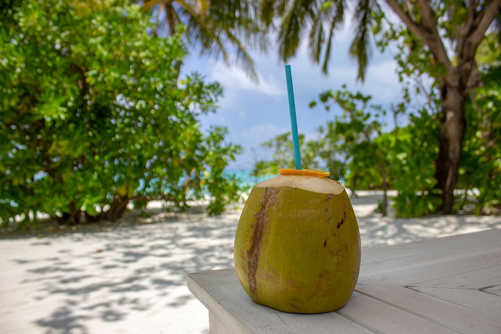 Coconut drink on a table. Free public domain CC0 image