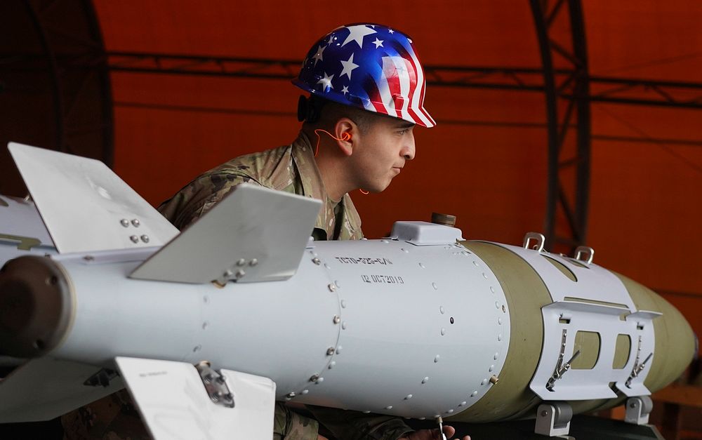 Senior Airman Alan Hernandez, a native of Houston, Texas, assigned to the 3rd Munitions Squadron, builds a GBU-32 (Guided…