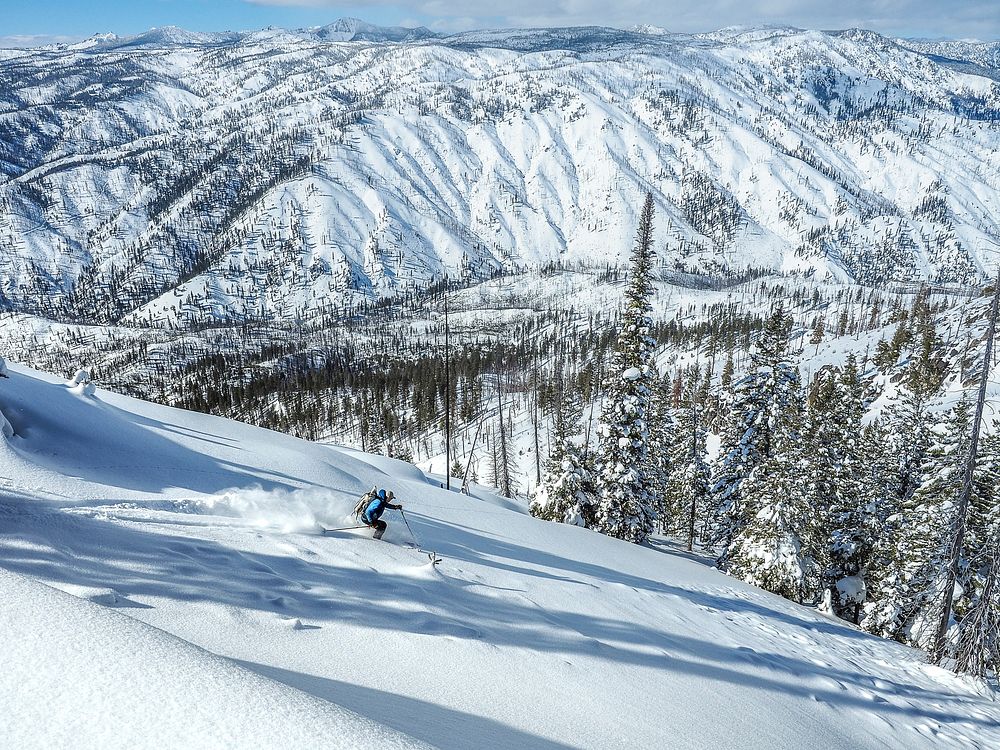 Man skiing on an un-named peak in the South Fork of the Salmon Watershed Idaho in the Payette National Forest near Yellow…