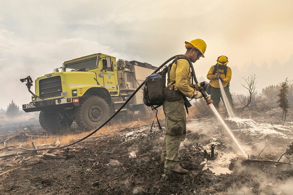 Trout Springs Rx Fire. Engine crew members mopping up spot fires. (DOI/Neal Herbert). Original public domain image from…