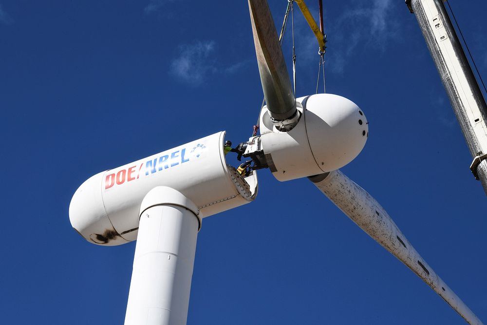 NREL engineers and technicians install the SUMR rotor onto the Cart 2 research turbine at NREL's National Wind Technology…